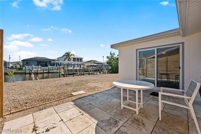 view of patio / terrace with a water view