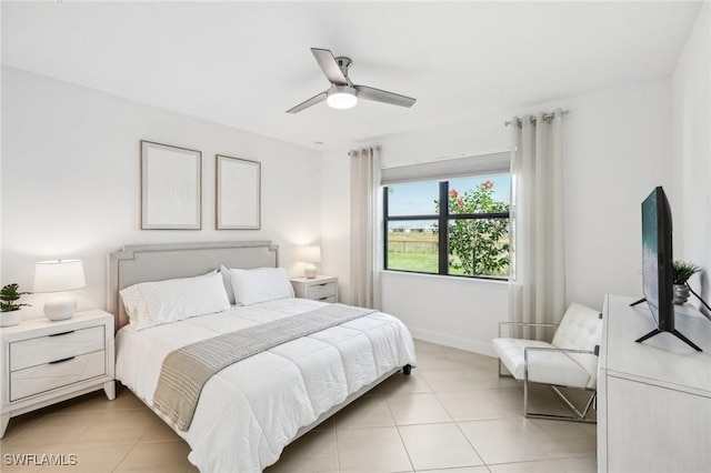 bedroom with ceiling fan and light tile patterned floors