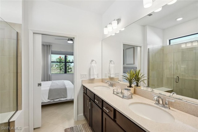 bathroom with tile patterned floors, vanity, and an enclosed shower