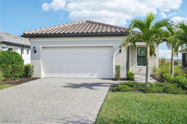 view of front of house with a garage and a front yard