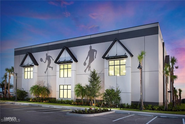 view of outdoor building at dusk