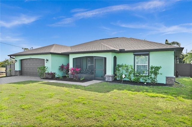 ranch-style house with a garage and a front yard