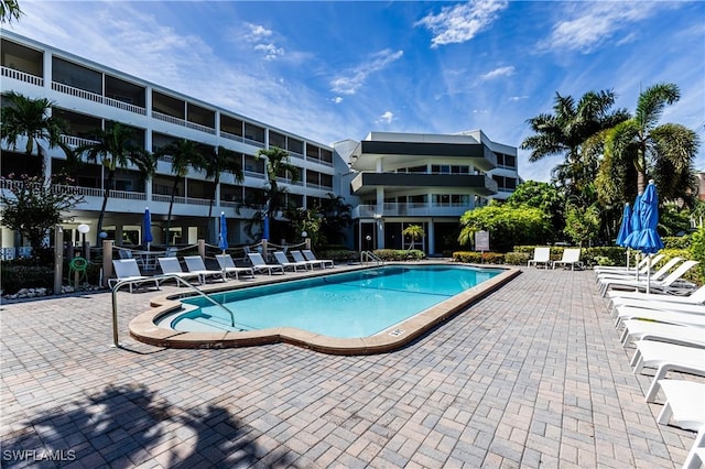 view of swimming pool featuring a patio