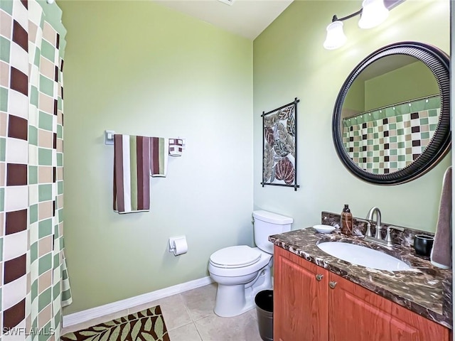 bathroom with tile patterned floors, vanity, and toilet