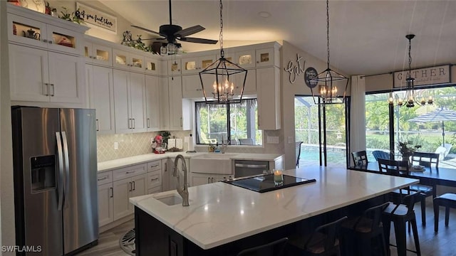 kitchen featuring stainless steel appliances, sink, and white cabinets