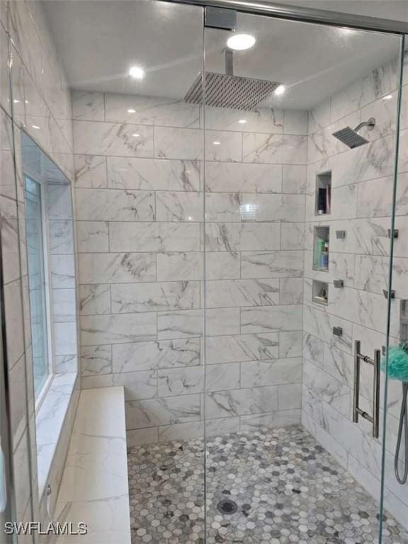 bathroom featuring an enclosed shower