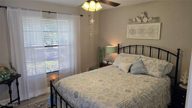 bedroom featuring wood-type flooring and ceiling fan