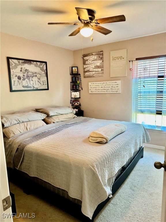 bedroom featuring carpet and ceiling fan