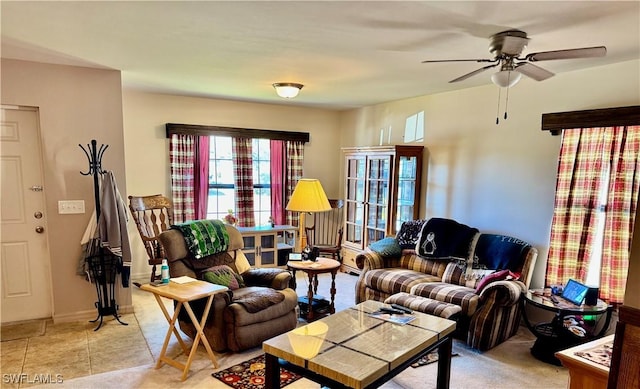 living room with a ceiling fan and light tile patterned floors