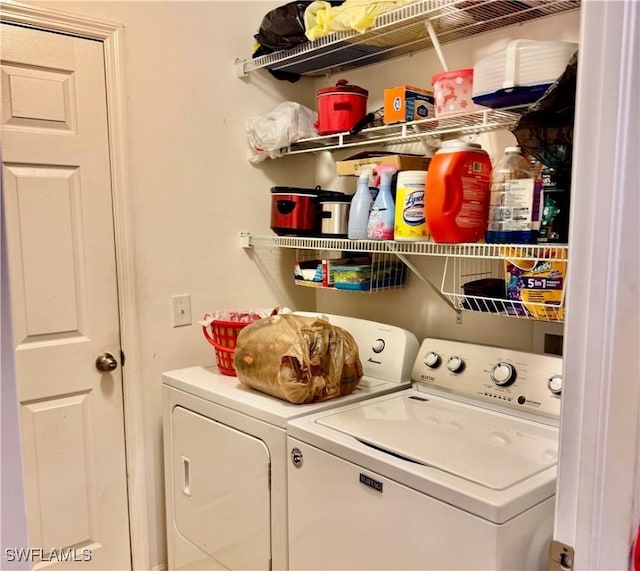 washroom featuring laundry area and washer and clothes dryer