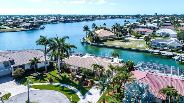 birds eye view of property with a water view