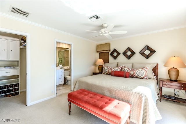 carpeted bedroom with connected bathroom, ceiling fan, and ornamental molding