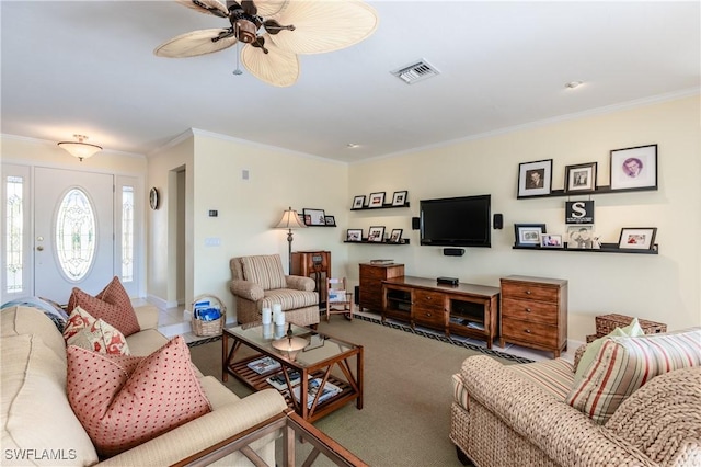 living room with carpet flooring, crown molding, and ceiling fan