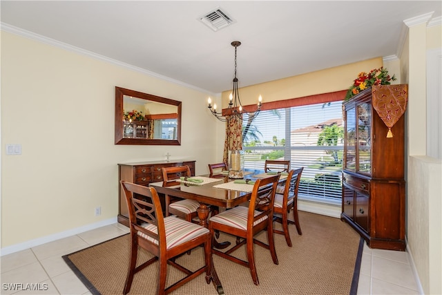 tiled dining area with crown molding and a chandelier