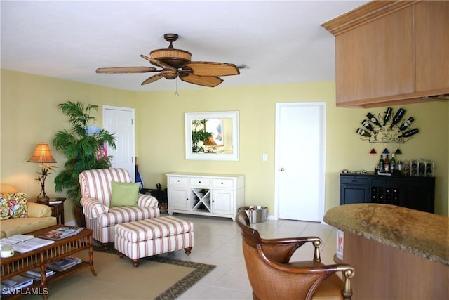 living room featuring ceiling fan and light tile patterned flooring