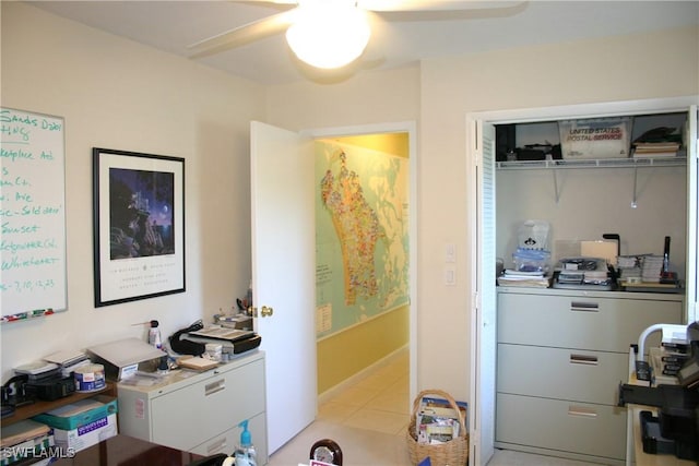 interior space featuring light tile patterned floors and ceiling fan