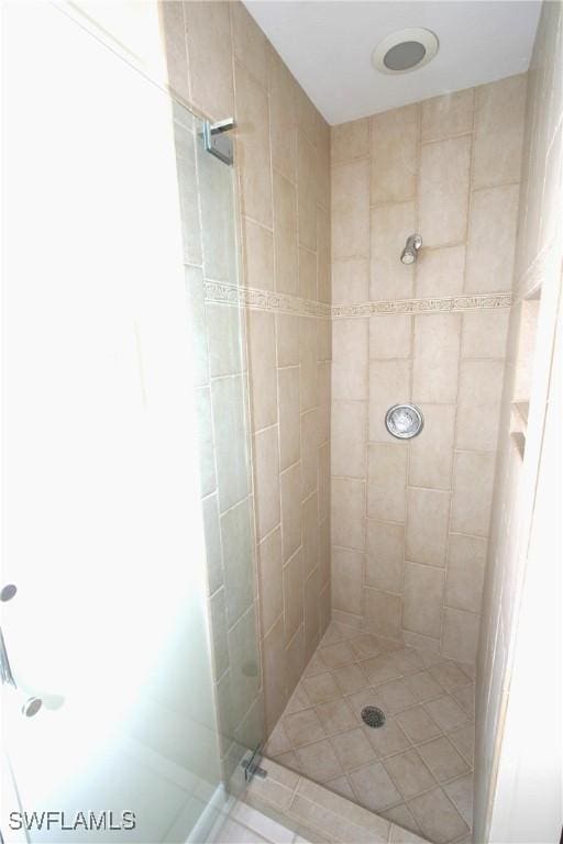 bathroom with tiled shower