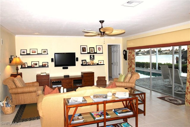 tiled living room featuring ceiling fan and crown molding