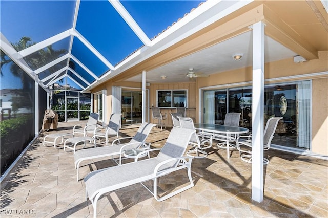 view of patio / terrace with a lanai and ceiling fan