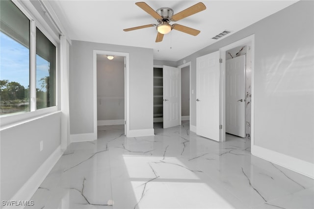 bedroom featuring ceiling fan and a closet