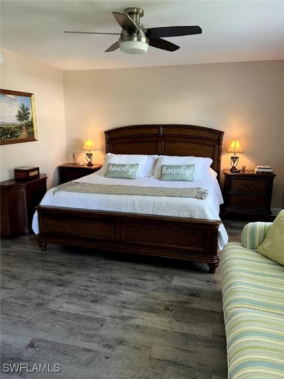 bedroom with ceiling fan and wood finished floors