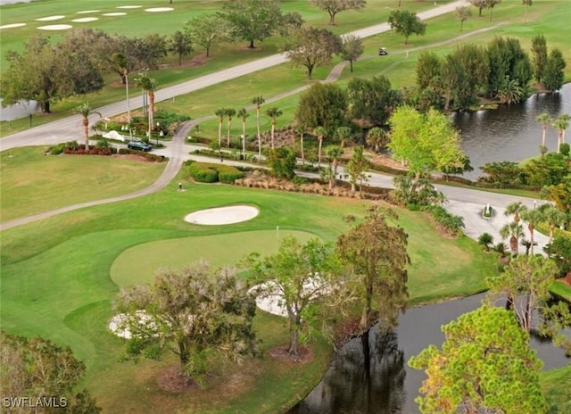 bird's eye view with a water view and golf course view