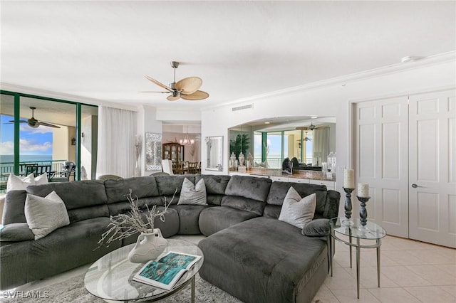 living area featuring light tile patterned floors, visible vents, a healthy amount of sunlight, and crown molding