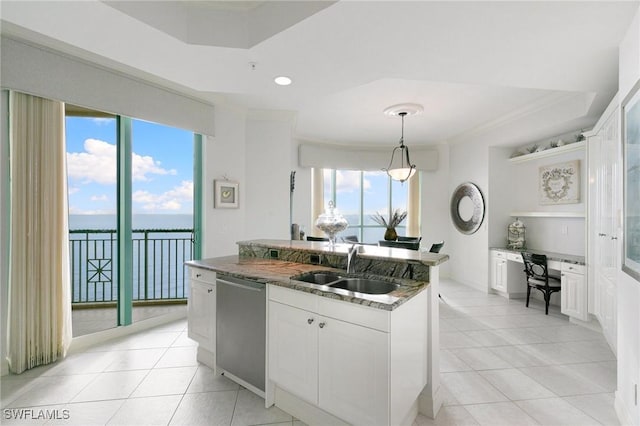 kitchen with open shelves, dark stone counters, an island with sink, a sink, and dishwasher