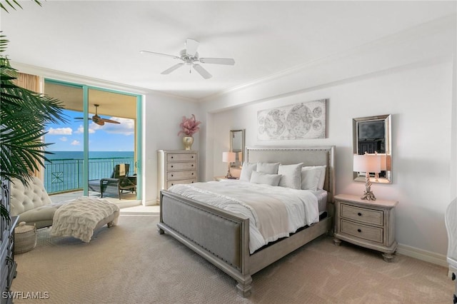 carpeted bedroom with ceiling fan, baseboards, ornamental molding, expansive windows, and access to outside