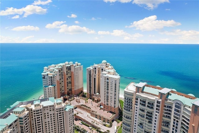 aerial view featuring a view of city and a water view