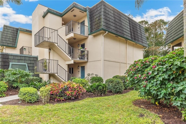 1760 Bald Eagle Dr Unit 506B, Naples, FL 34105 - view of building exterior with stairway
