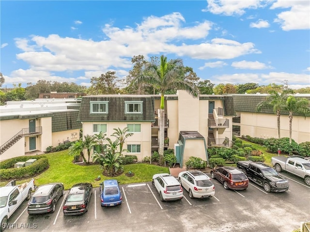 1760 Bald Eagle Dr Unit 506B, Naples, FL 34105 - view of building exterior with uncovered parking