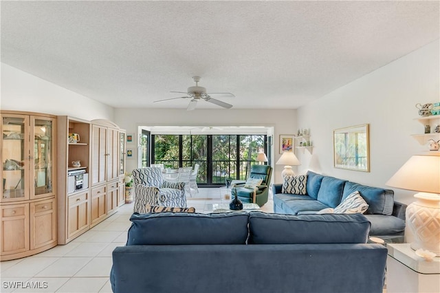 1760 Bald Eagle Dr Unit 506B, Naples, FL 34105 - living room featuring light tile patterned floors, a ceiling fan, and a textured ceiling