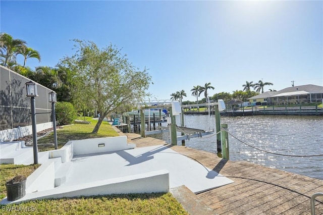 exterior space with a boat dock and a water view