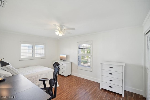 bedroom featuring a closet, ceiling fan, crown molding, and dark hardwood / wood-style floors