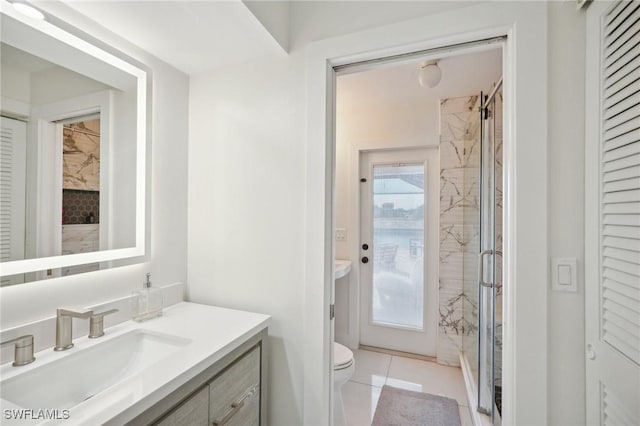 bathroom with toilet, walk in shower, tile patterned flooring, and vanity