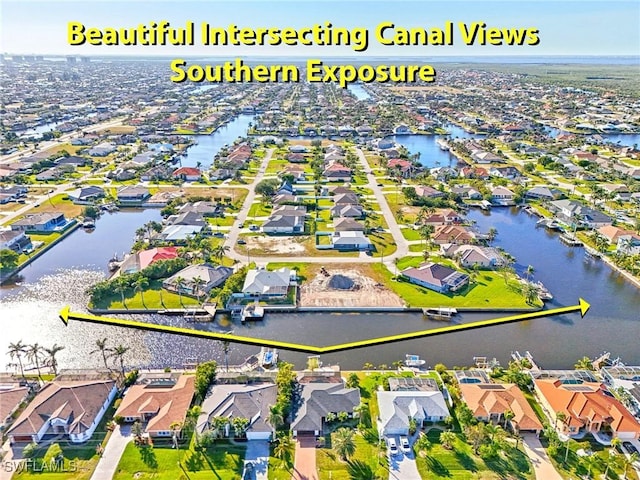 aerial view with a water view and a residential view