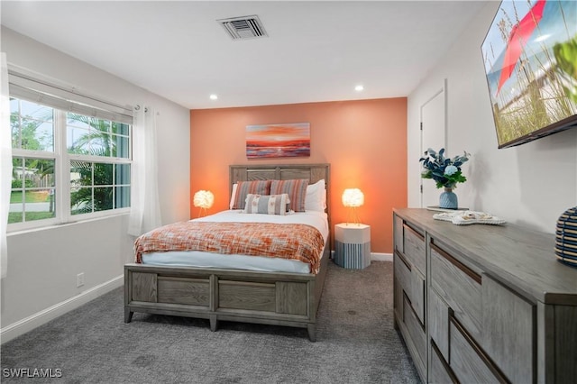 bedroom featuring dark colored carpet