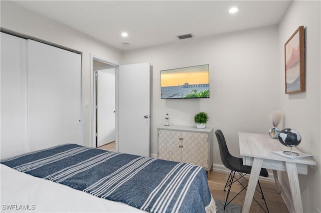 bedroom featuring a closet and light hardwood / wood-style floors