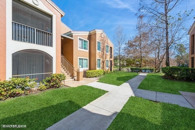 surrounding community featuring a lawn