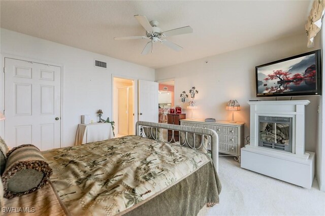 carpeted bedroom with ceiling fan