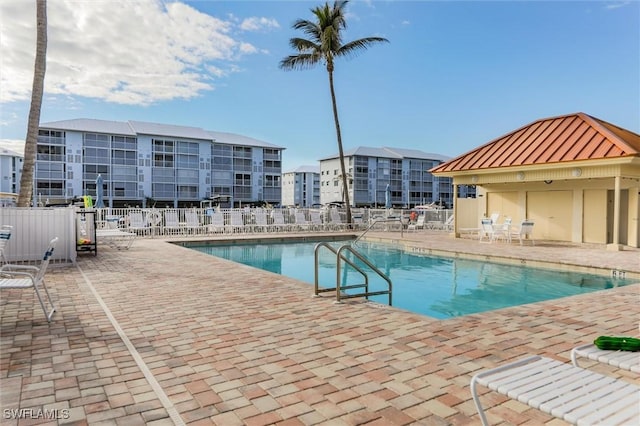 view of swimming pool with a patio