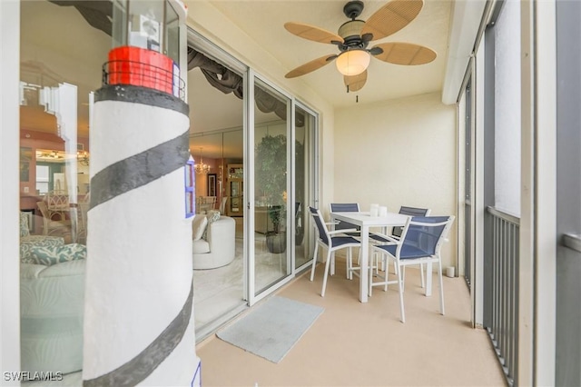 sunroom / solarium featuring ceiling fan