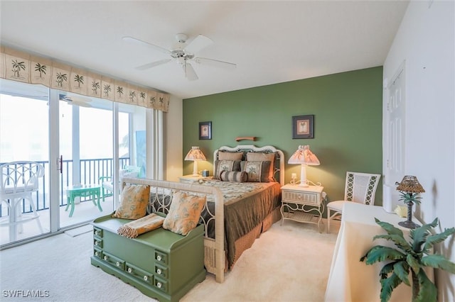 carpeted bedroom featuring access to exterior and ceiling fan