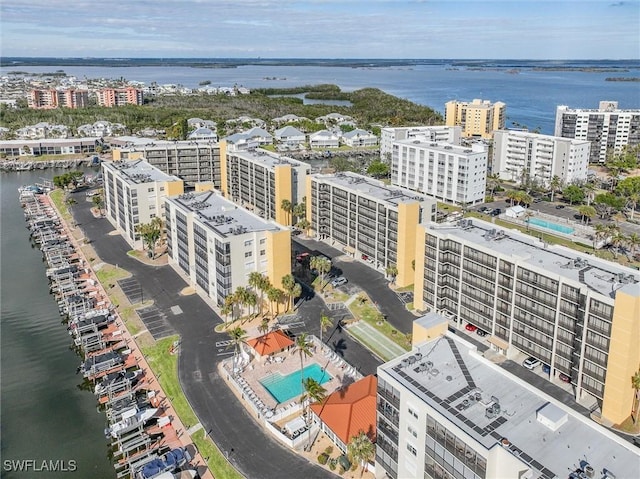 birds eye view of property with a water view