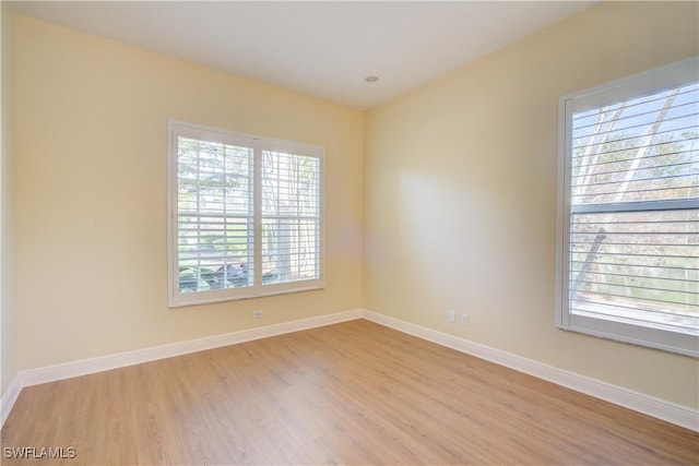 unfurnished room featuring light hardwood / wood-style floors