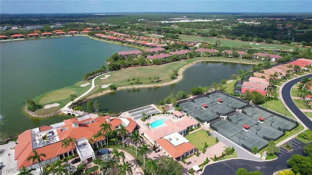 birds eye view of property with a water view