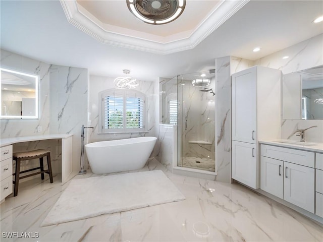 bathroom with vanity, shower with separate bathtub, a raised ceiling, and crown molding