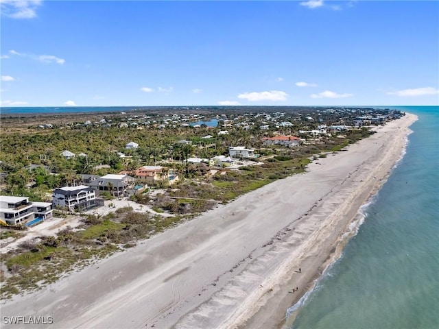 aerial view with a water view and a view of the beach