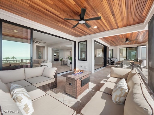 view of patio featuring an outdoor living space with a fire pit